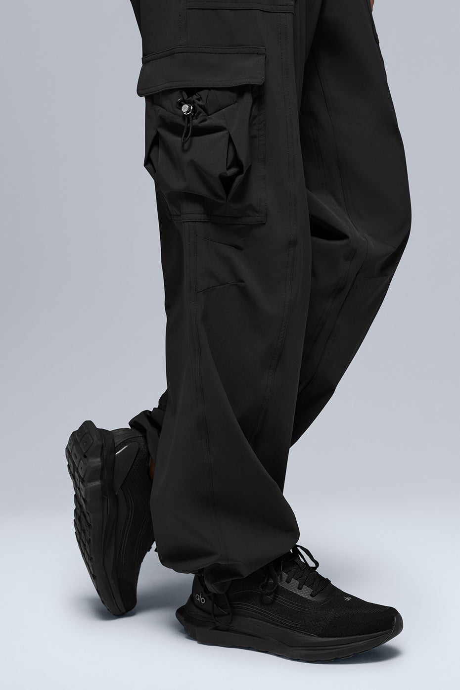 Megastar Cargo Pant in black, showcasing straight legs and adjustable bungee waist for a modern Y2K style.