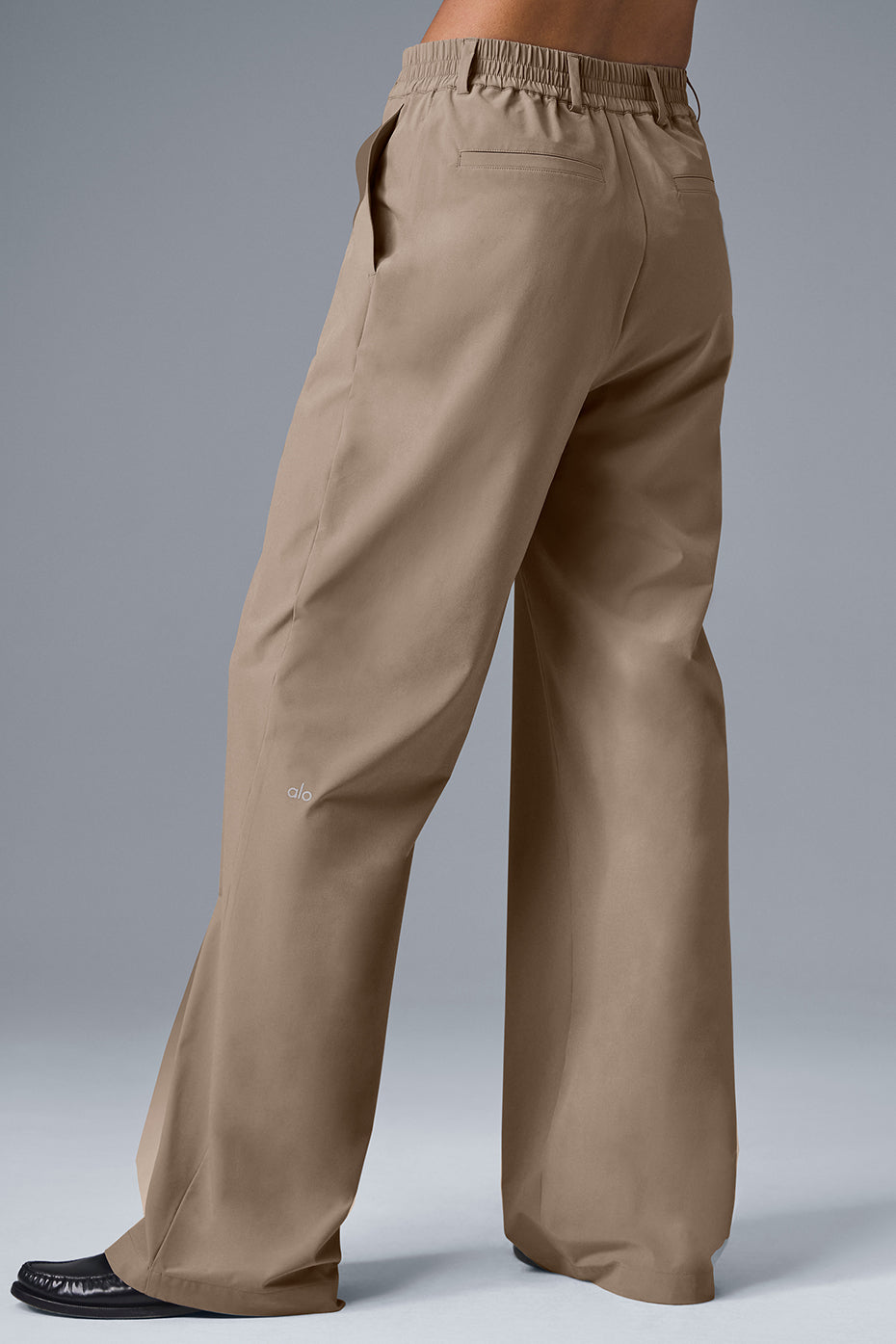 High-waist pursuit trouser in tan, showcasing wide-leg fit and relaxed style for modern everyday wear.