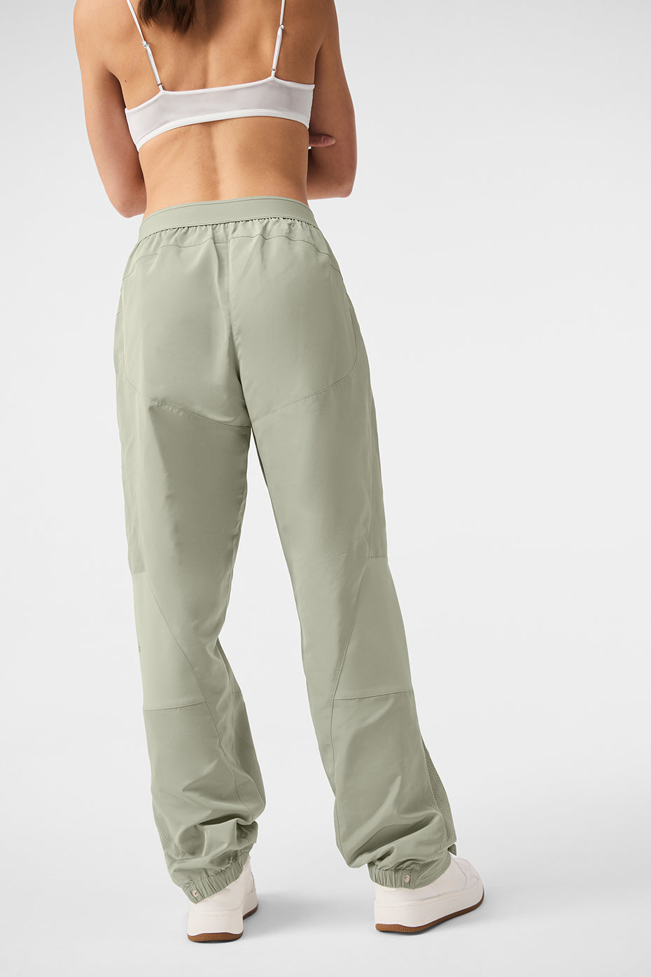Back view of soft mixed media joggers with contrasting panels in a relaxed fit and stretchy waistband.
