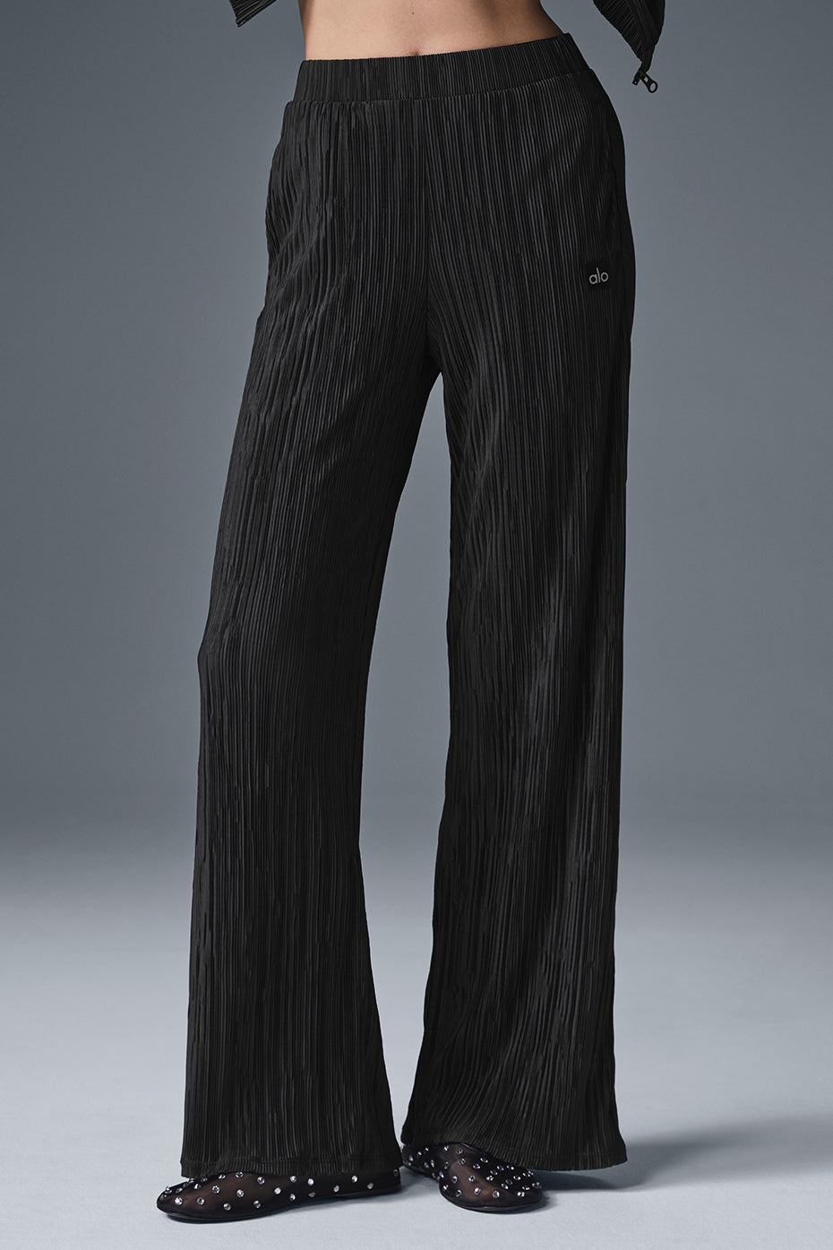 High-waist micro plisse straight leg pant with relaxed fit and soft mini-pleat texture, designed to puddle at the ankle.