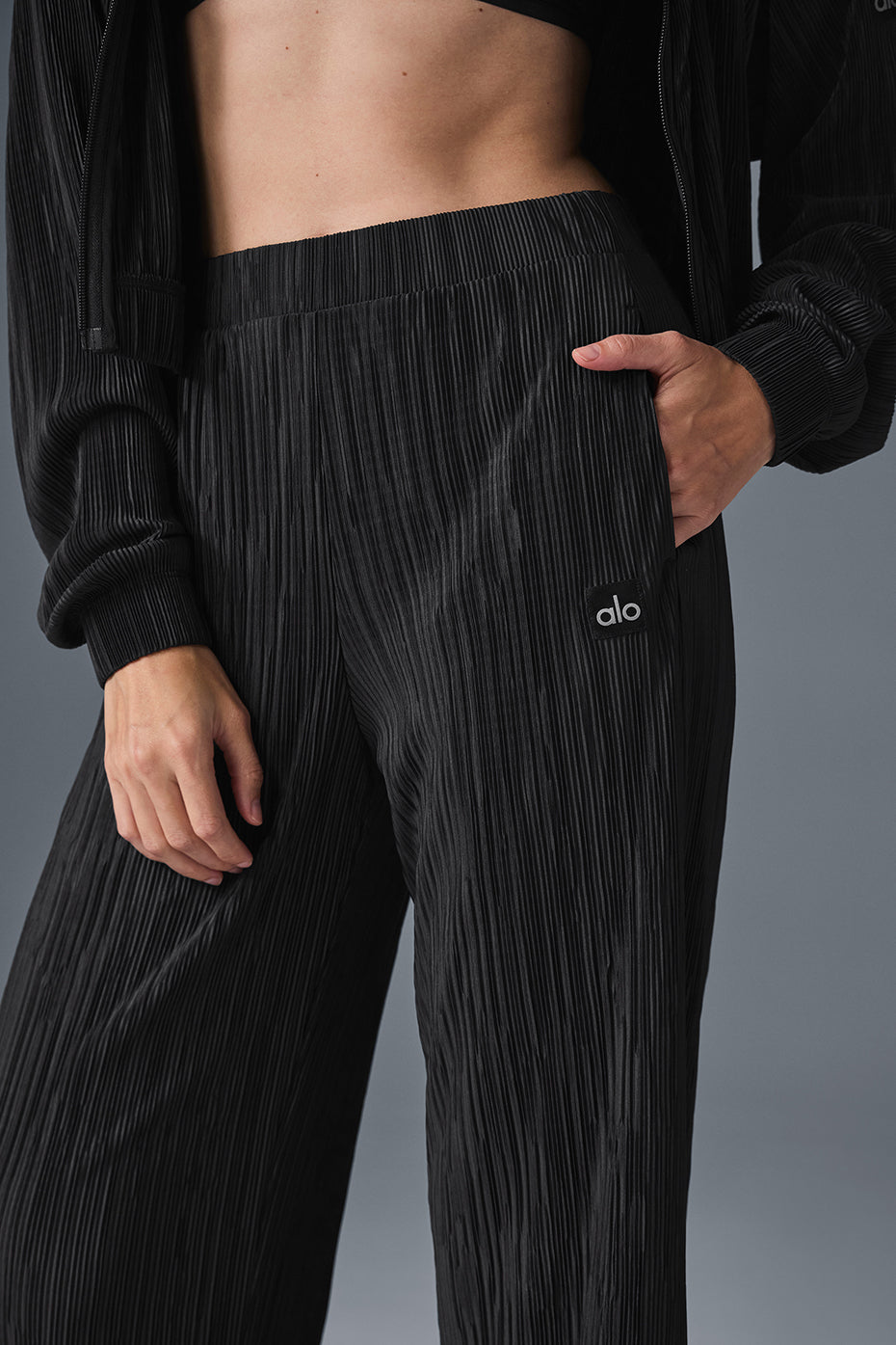 High-waist micro plisse straight leg pant with relaxed fit and crinkly mini-pleat texture, perfect for a stylish casual look.