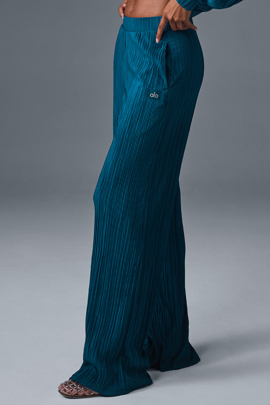 High-waist micro plisse straight leg pant with a relaxed fit and soft mini-pleat texture in teal.