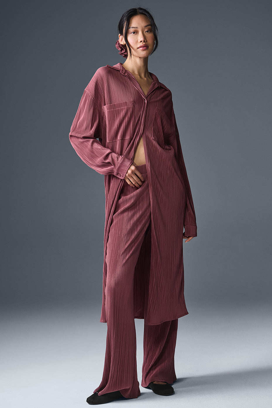 High-waist micro plisse straight leg pants with relaxed fit and soft crinkly texture, styled with a matching top.