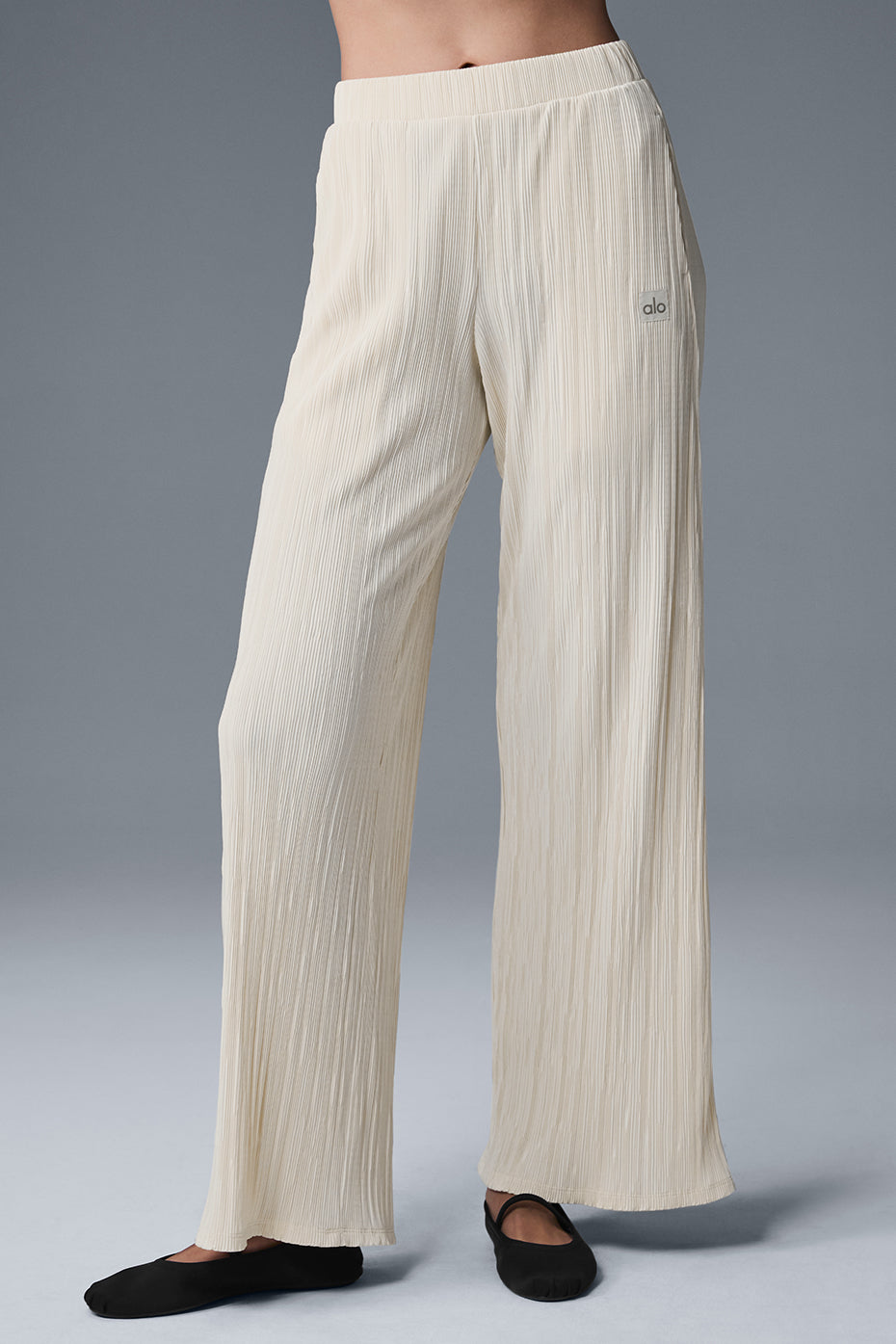 High-waist micro plisse straight leg pant with a relaxed fit and soft mini-pleat texture in a light color