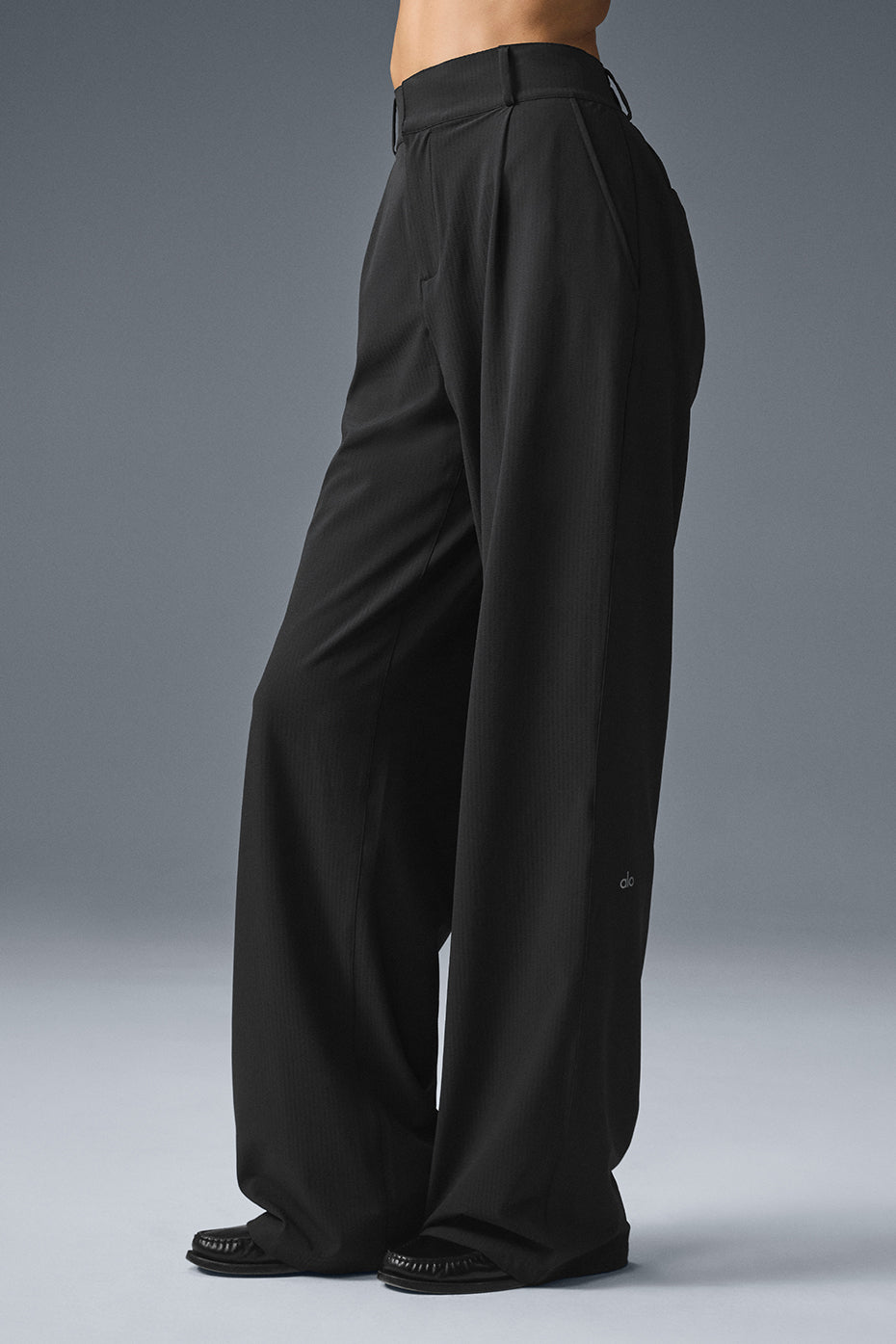 High-waist Dreamscape Trouser in black, featuring a pleated design and lightweight crinkle woven fabric.