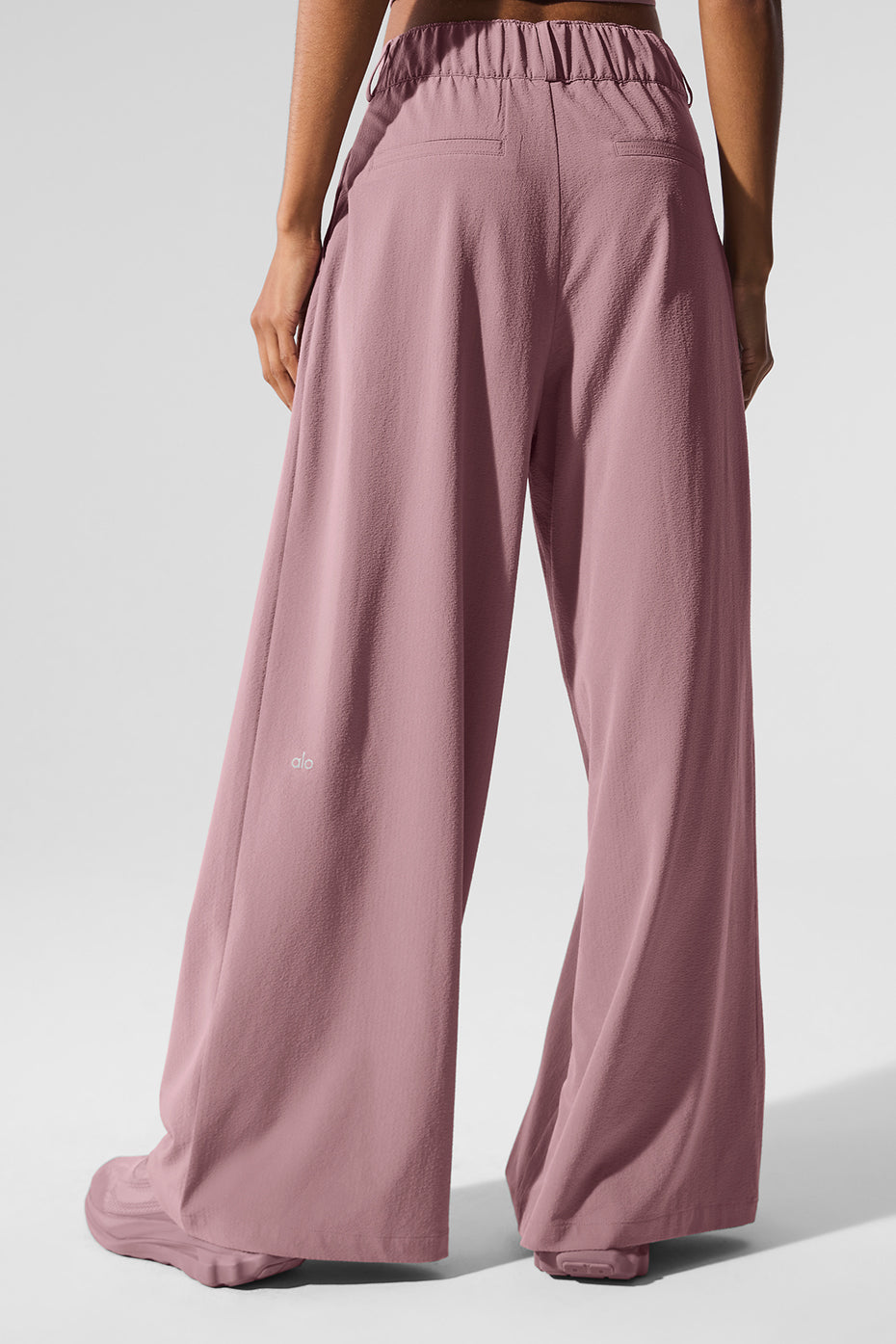 Back view of High-Waist Dreamscape Trouser in lightweight crinkle fabric showcasing relaxed fit and pleated design.