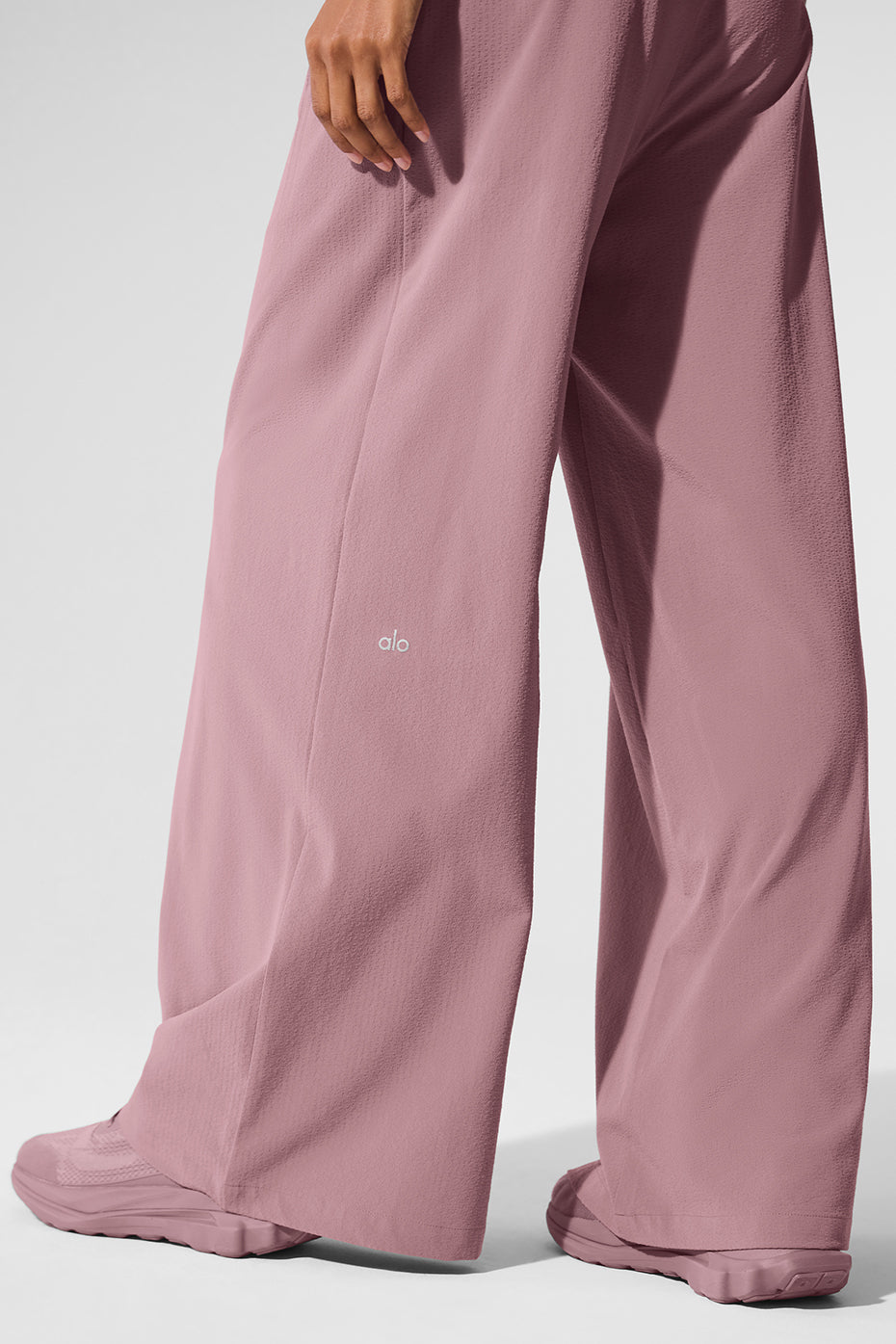 High-waist Dreamscape trouser in lightweight crinkle fabric, designed for comfort and style, shown in a soft pink color.