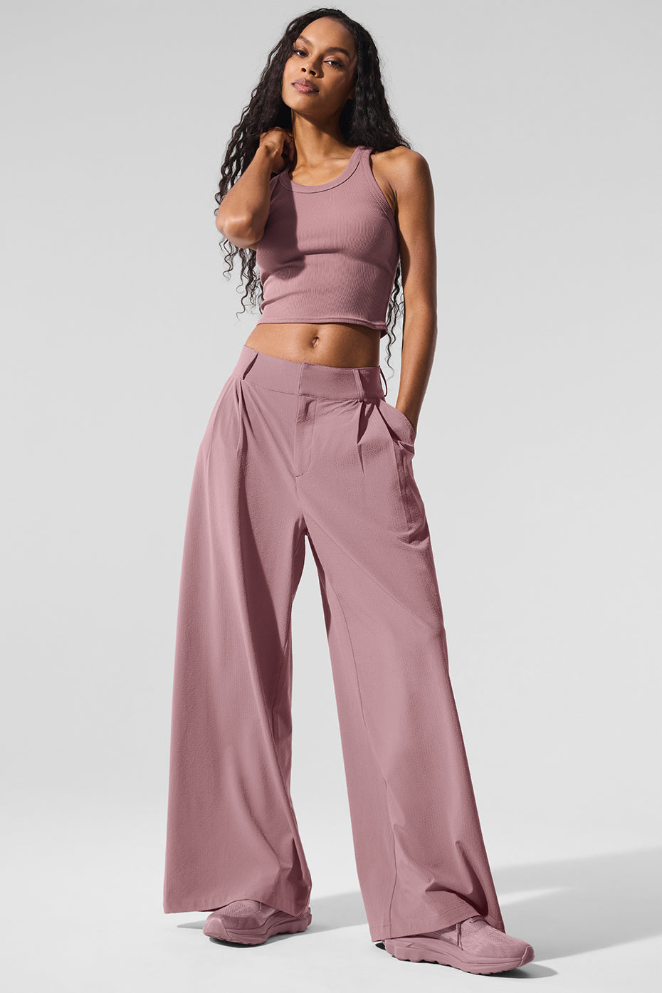 Model wearing High-Waist Dreamscape Trouser paired with a crop top, showcasing lightweight crinkle woven fabric and pleated silhouette.