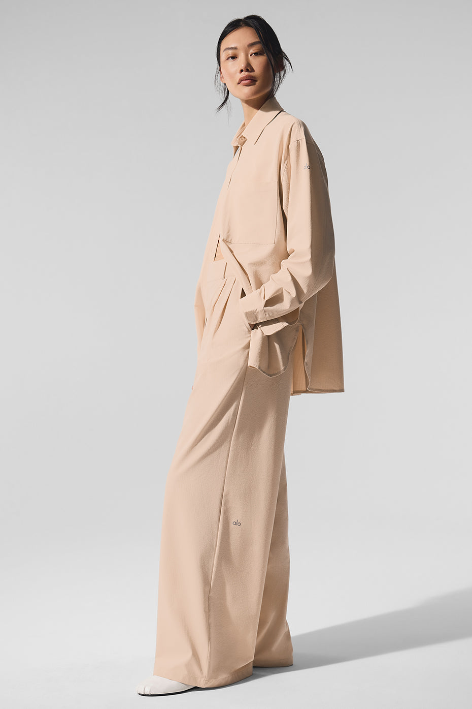Woman wearing High-Waist Dreamscape Trouser with matching Dreamscape Button Down Long Sleeve in a stylish pose.