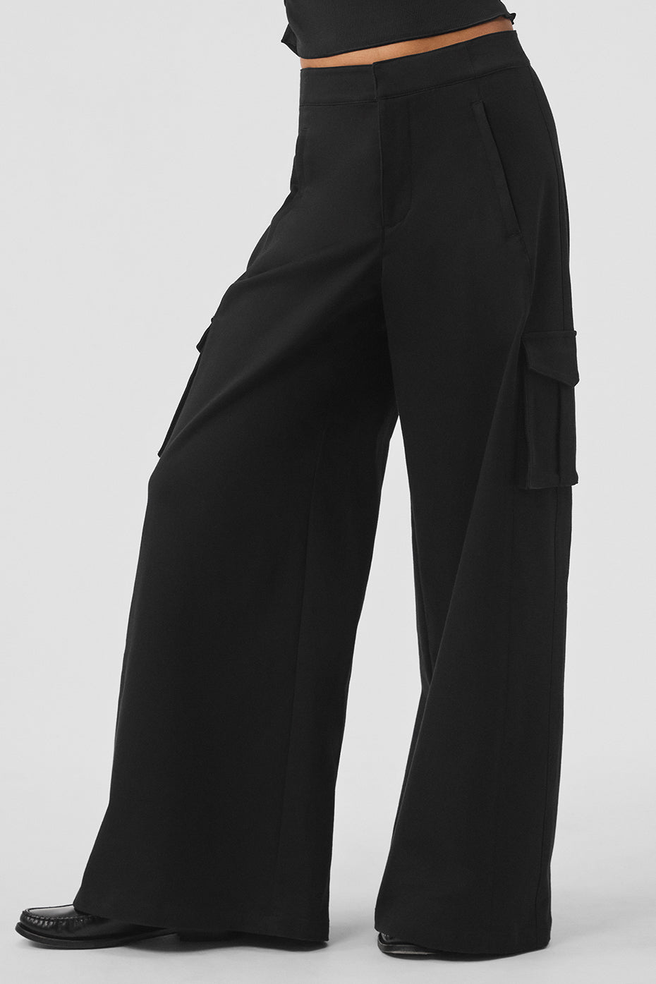 Show Off Cargo Wide Leg Trouser featuring wide legs, cargo pockets, and front zipper pockets in black.