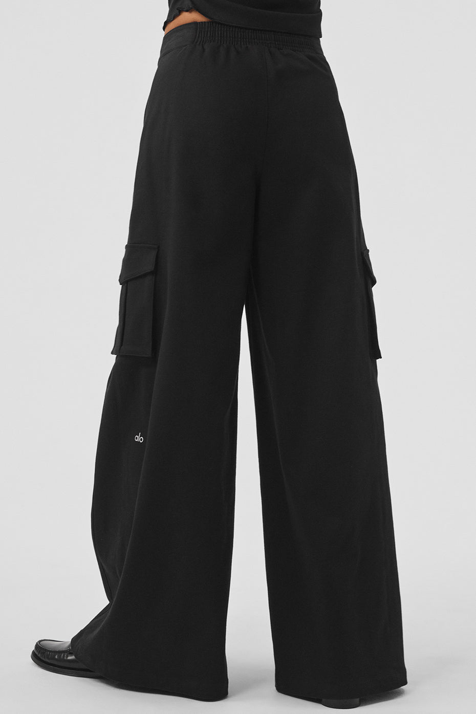 Back view of Show Off Cargo Wide Leg Trouser in black with exaggerated wide legs and cargo pockets.
