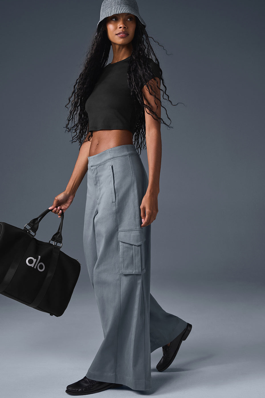 Wide leg cargo trousers paired with a crop top, showcasing a stylish look with functional pockets.