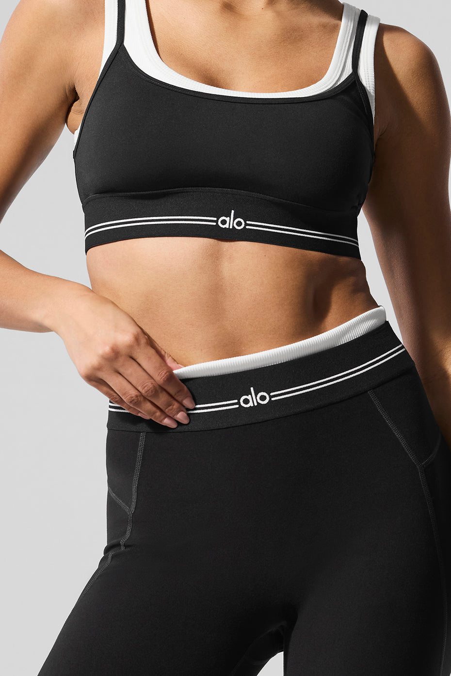 Model wearing Airbrush Better Together Bra and High-Waist Better Together Legging showing elastic logo waistband.