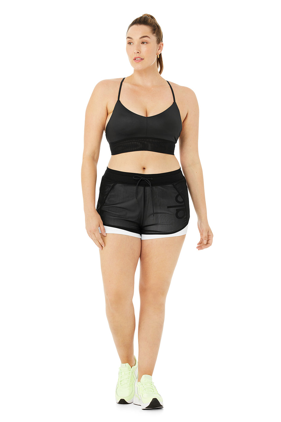 Model wearing Ambience Short with stretchy performance bottom and micro mesh top for studio-to-street style.
