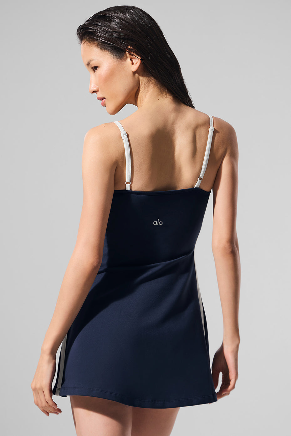 Navy Airbrush Streamlined Dress showcasing a sleek A-line fit with slender straps and built-in shorts for comfort.