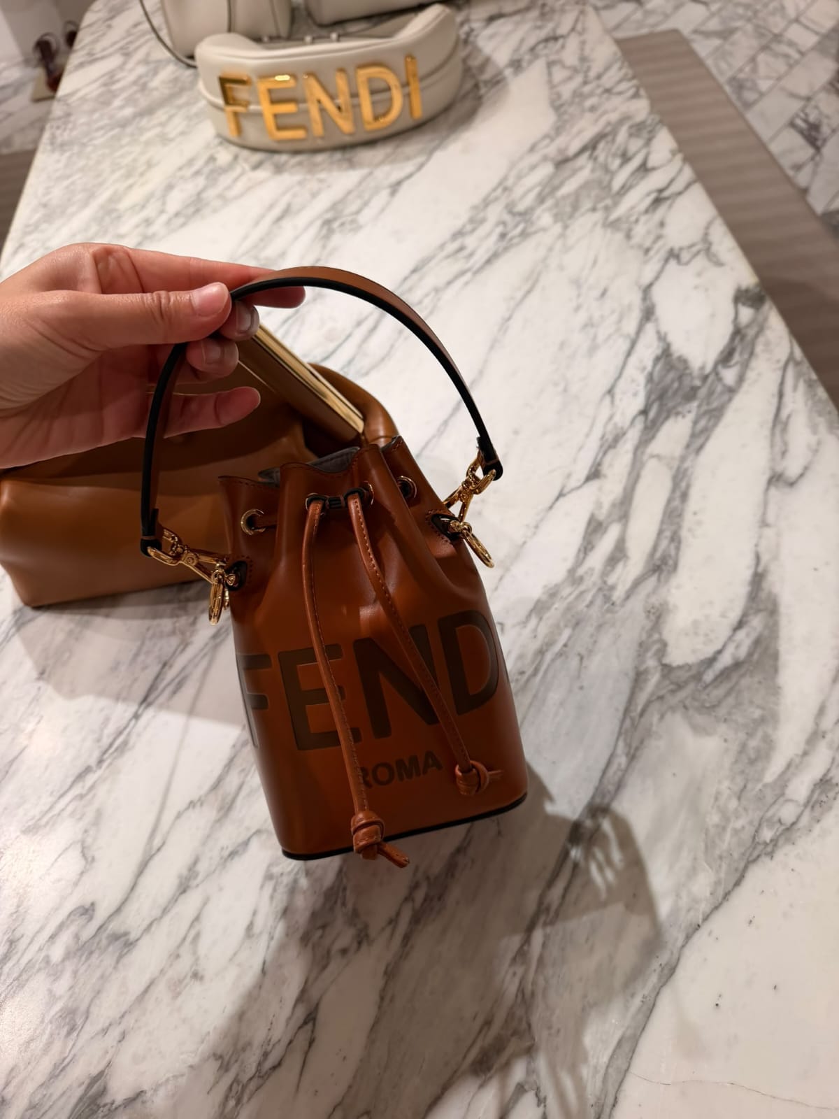 Vitello King F is Fendi Logo Embossed Mini Mon Tresor Bucket Bag Cuoio