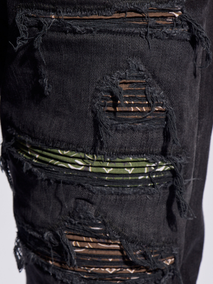 Amiri Bandana Camo Thrasher Jeans in Faded Black