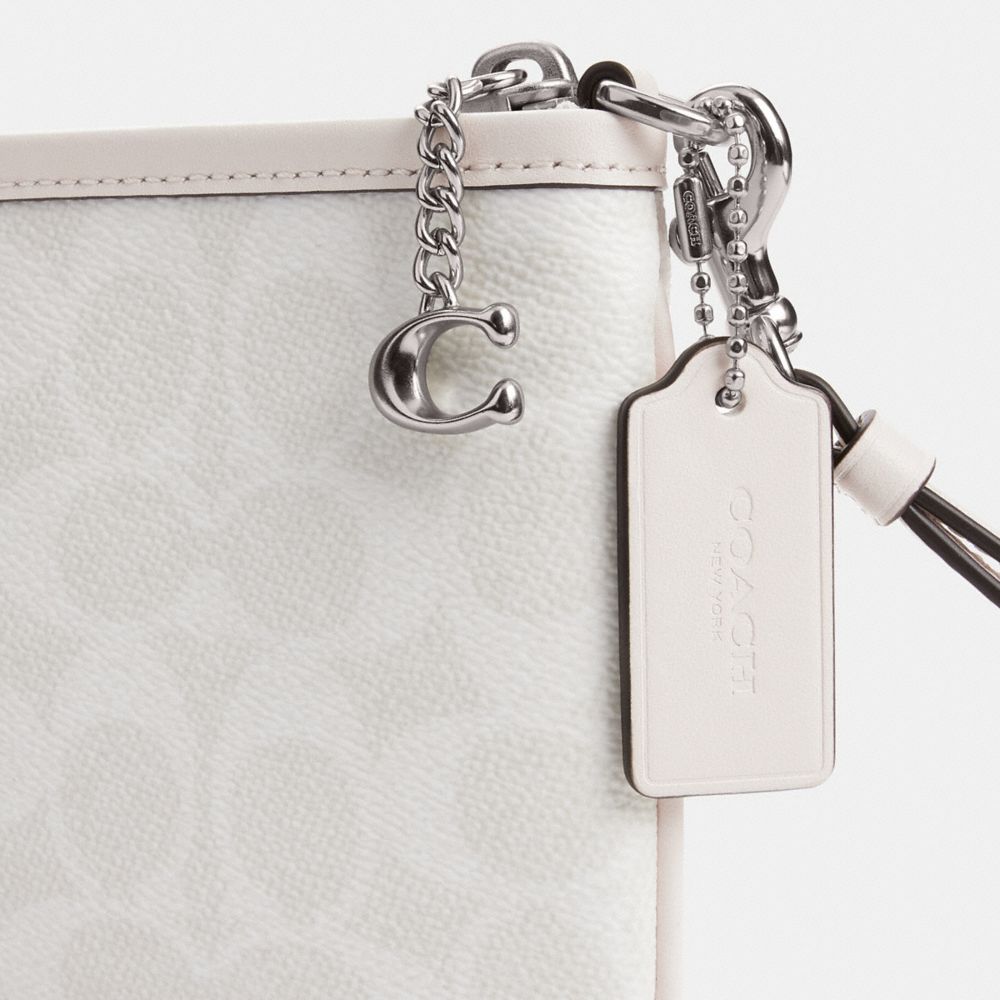 Pouch Bag In Signature Canvas