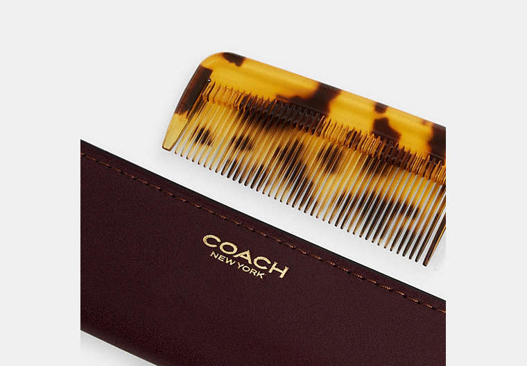 Comb With Sleeve