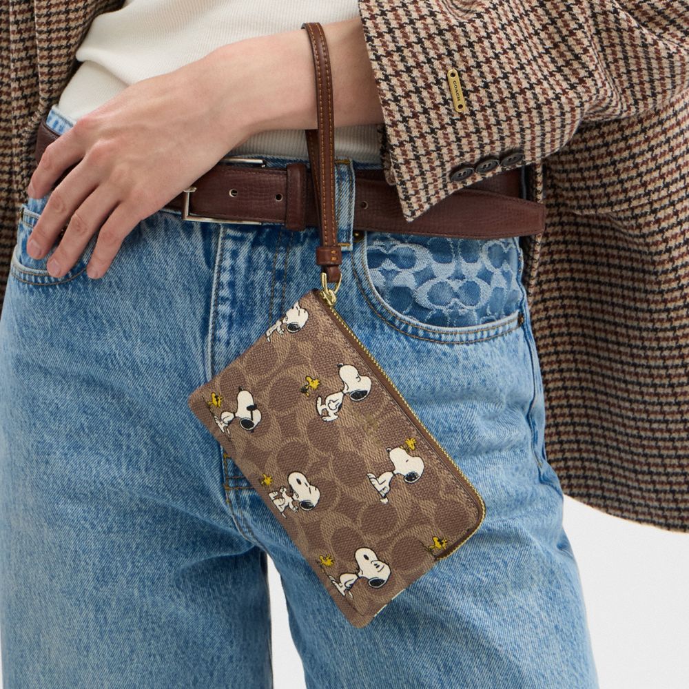 Coach X Peanuts Corner Zip Wristlet In Signature Canvas With Snoopy Print