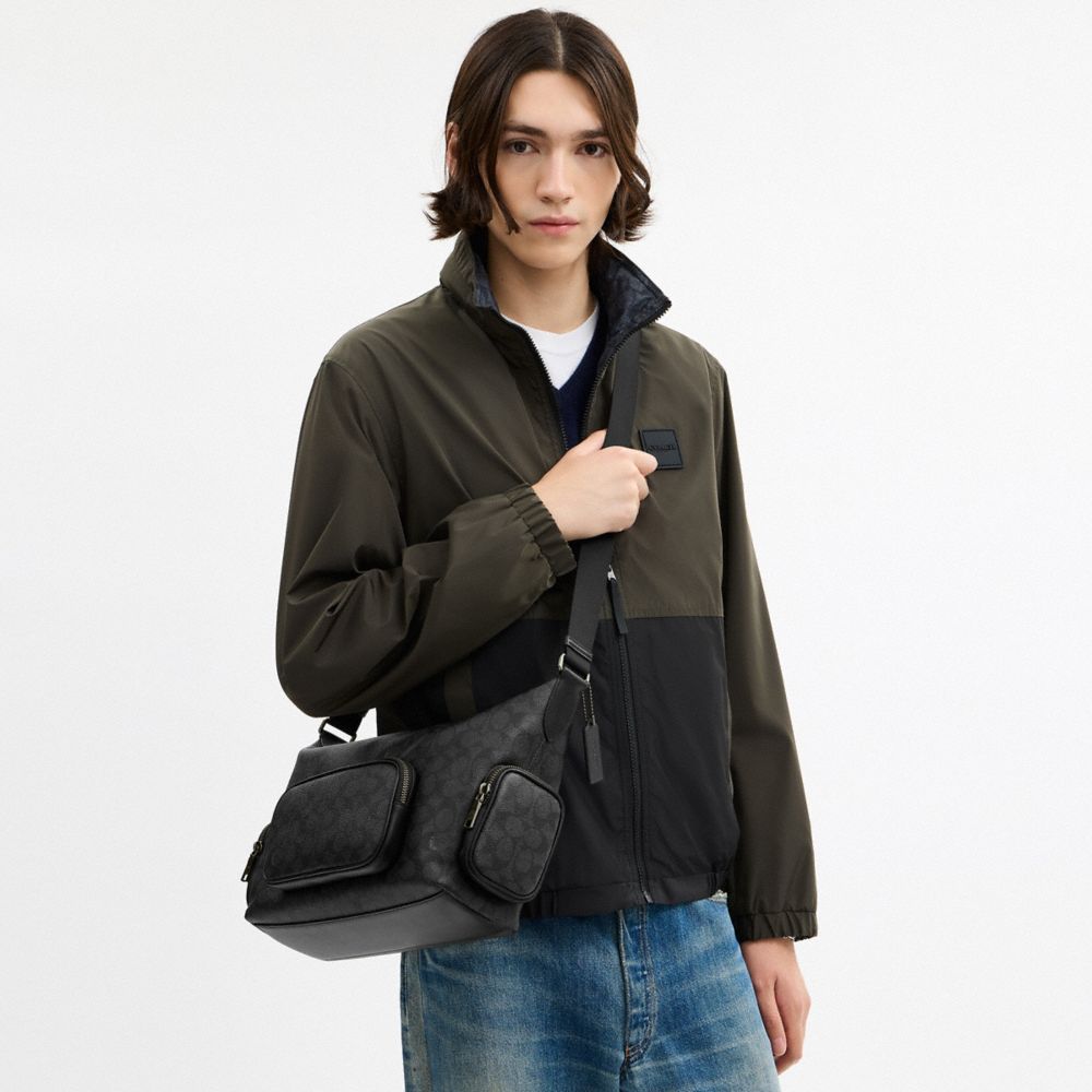 Finn Crossbody Bag With Pockets In Signature Canvas