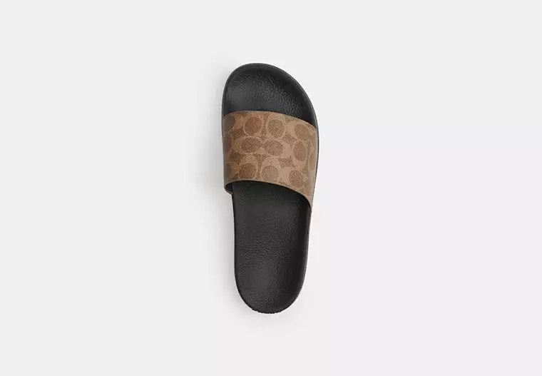 Udele Sport Slide In Signature Canvas slide sandal featuring classic C pattern and contoured footbed for comfort.