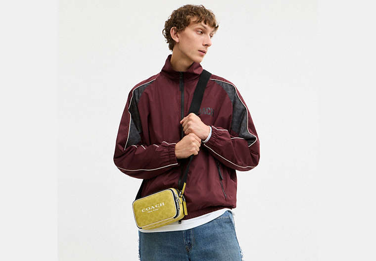 Colton Crossbody Bag 19 In Signature Canvas With Coach Graphic