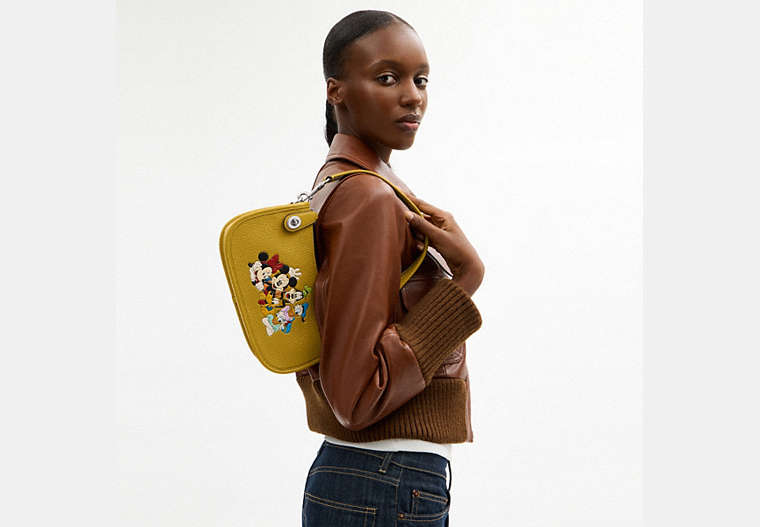 Disney X Coach Swinger Bag In Regenerative Leather With Mickey Mouse And Friends