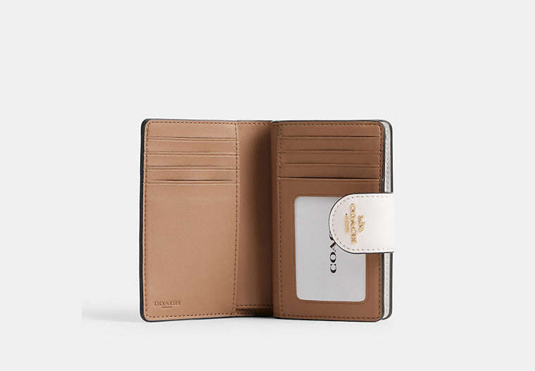 Medium Corner Zip Wallet In Signature Canvas