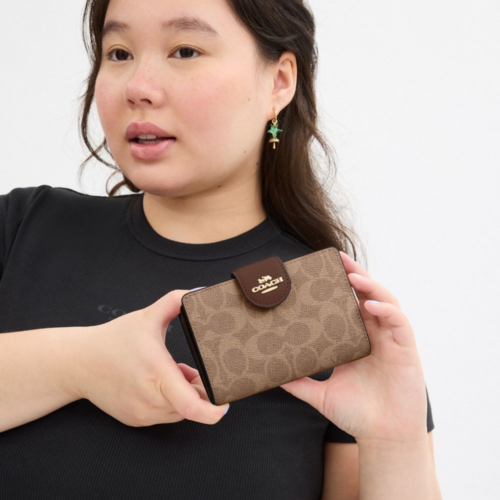 Medium Corner Zip Wallet In Signature Canvas