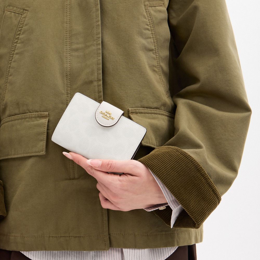 Medium Corner Zip Wallet In Signature Canvas