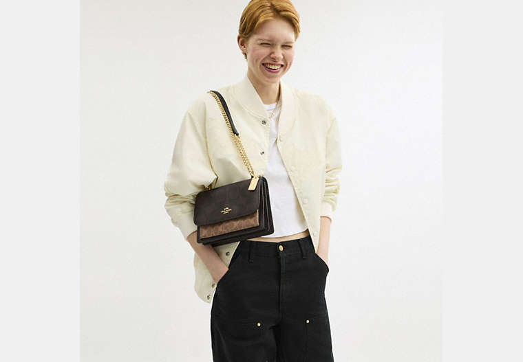 Klare Crossbody Bag In Blocked Signature Canvas