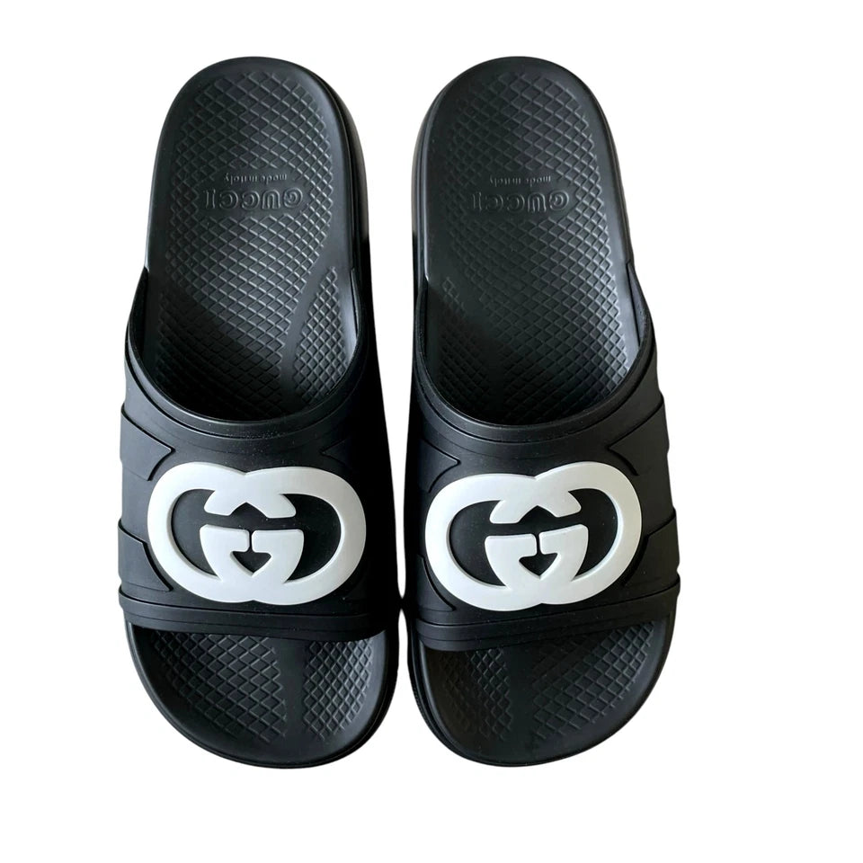 Gucci Pursuit Interlocking G slides featuring black molded rubber upper and iconic Interlocking G logo.