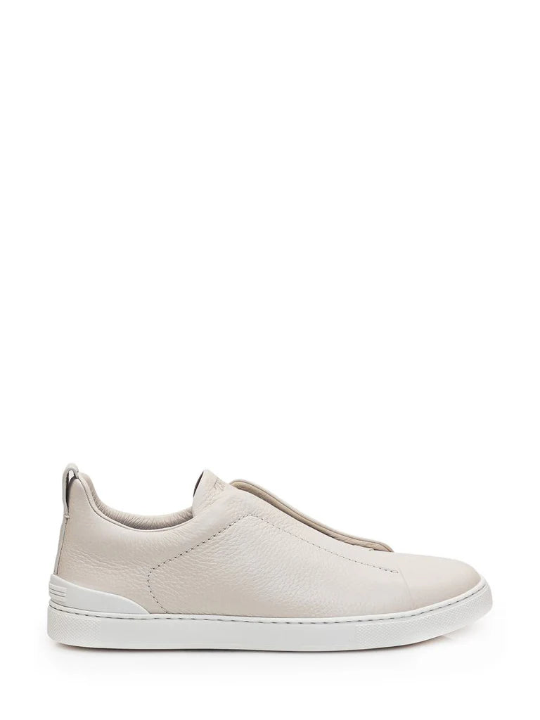 Zegna Men’s Cream Grained Leather Slip-On Sneakers – White Sole, Minimal Design