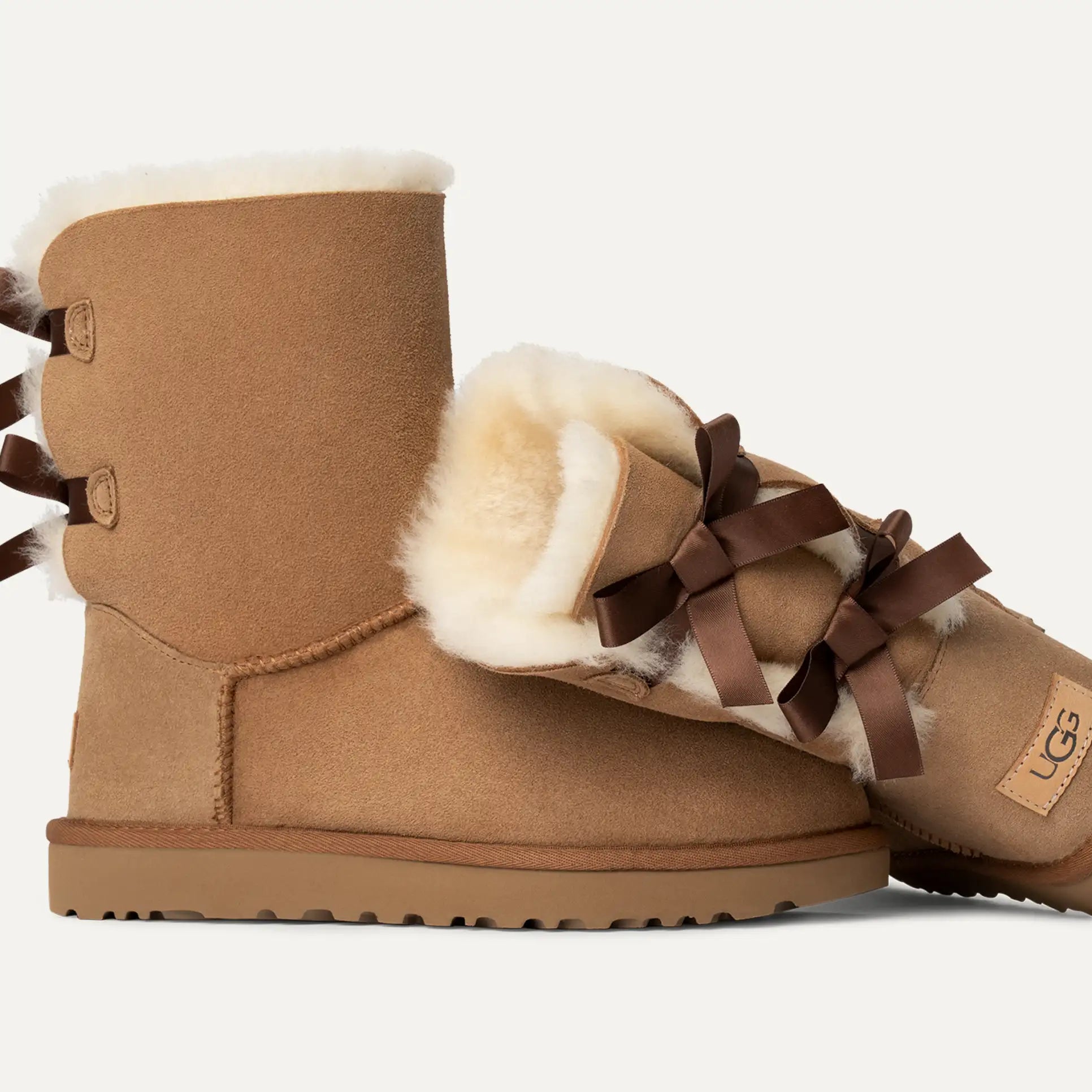 UGG® Bailey Bow Short Boot – Water-Resistant Sheepskin with Feminine Satin Bows
