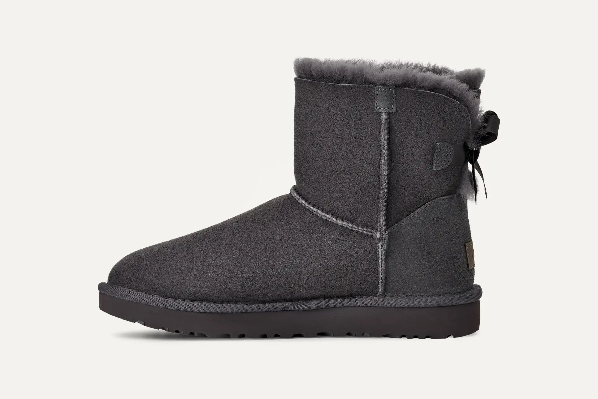 UGG® Mini Bailey Bow II Boot – Water-Resistant Sheepskin with Satin Bow Detail