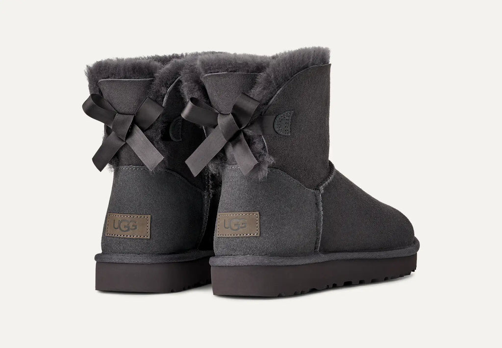 UGG® Mini Bailey Bow II Boot – Water-Resistant Sheepskin with Satin Bow Detail