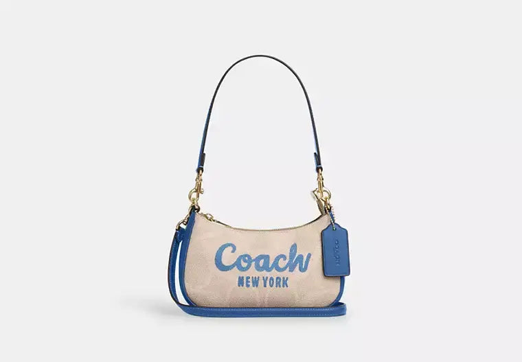 Coach Teri Mini Crossbody Bag In Signature Canvas With Coach Graphic - Bags | Shop From The Mirage