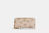 Coach Long Zip Around Wallet In Signature Canvas With Floral Print - Wallets | Shop From The Mirage