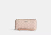 Coach Long Zip Around Wallet In Signature Canvas - Wallets | Shop From The Mirage