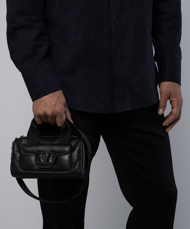 Black leather bag with logo