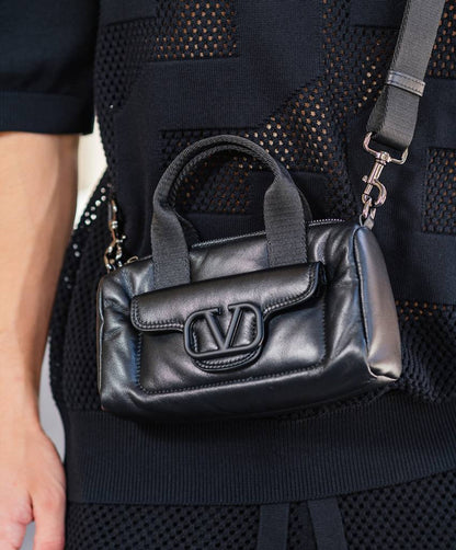 Black leather bag with logo
