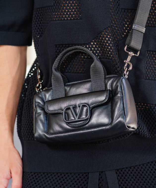 Black leather bag with logo