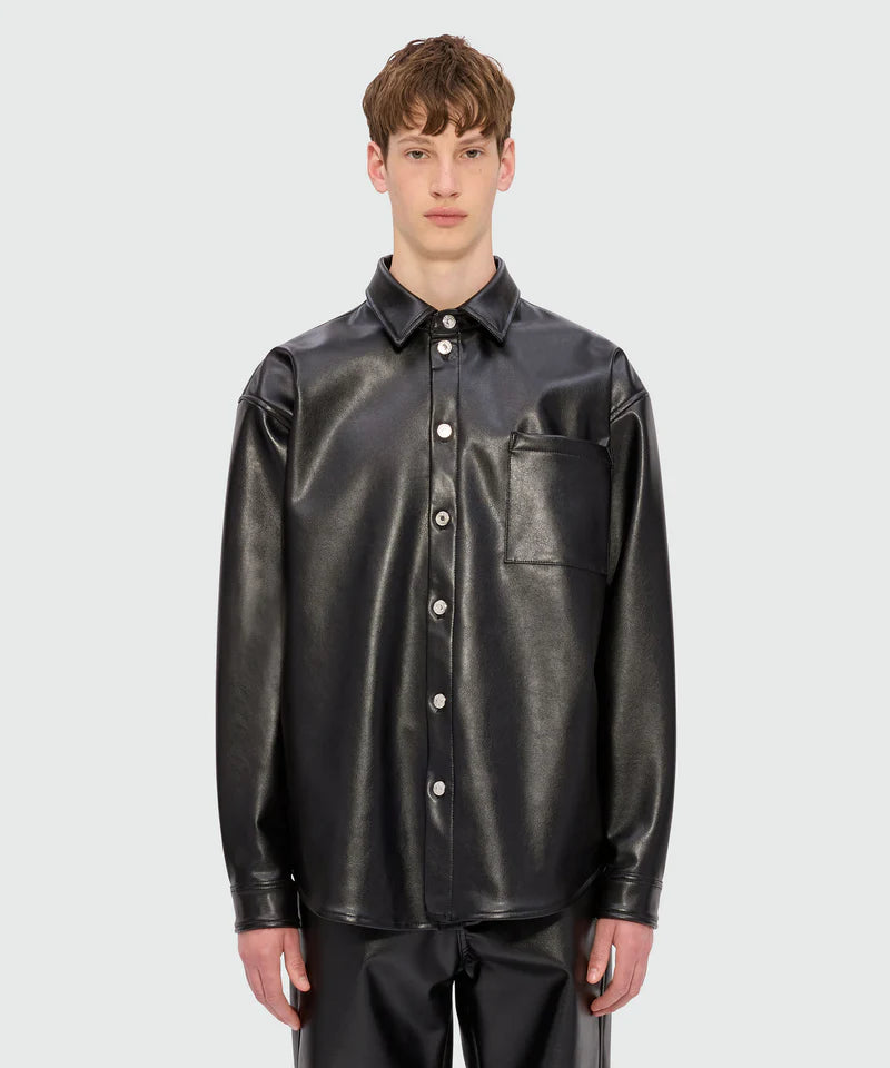 Black shirt with faux leather pocket, long sleeves, classic collar, oversized fit, and button closure.