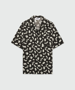 Black poplin bowling shirt with Follow the Rabbit print, short-sleeved, oversized fit, featuring a chest pocket.