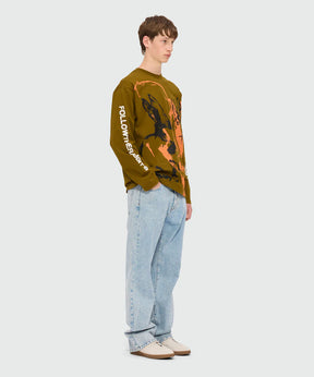 Olive green jersey T-shirt with Sketched Bunnies print and Follow the Rabbit quote on sleeves, worn by male model.