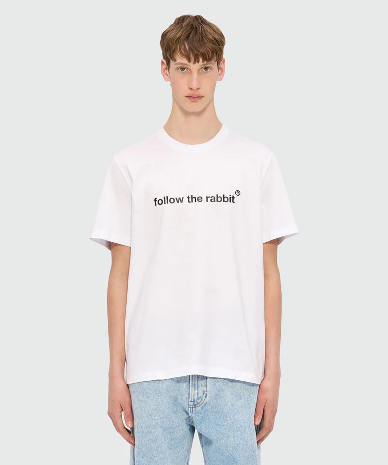 White jersey T-shirt with Follow the Rabbit print, crew-neck style and MSGM logo on the back, model wearing size M/48.
