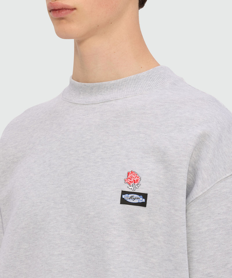 Grey melange jersey sweatshirt with MSGM Roses patch on the chest and ribbed collar, cuffs, and hem.