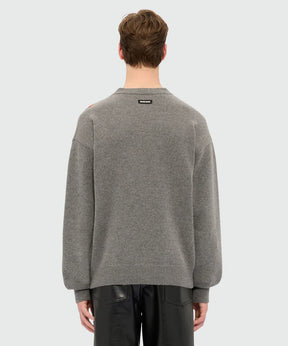Back view of grey crew neck sweater with MSGM label, featuring ribbed cuffs and hem.