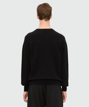 Back view of black cashmere blend sweater with ribbed details and regular fit.